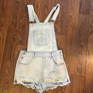 Size 4 light wash overalls.